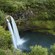 A waterfall cascading into a natural pool